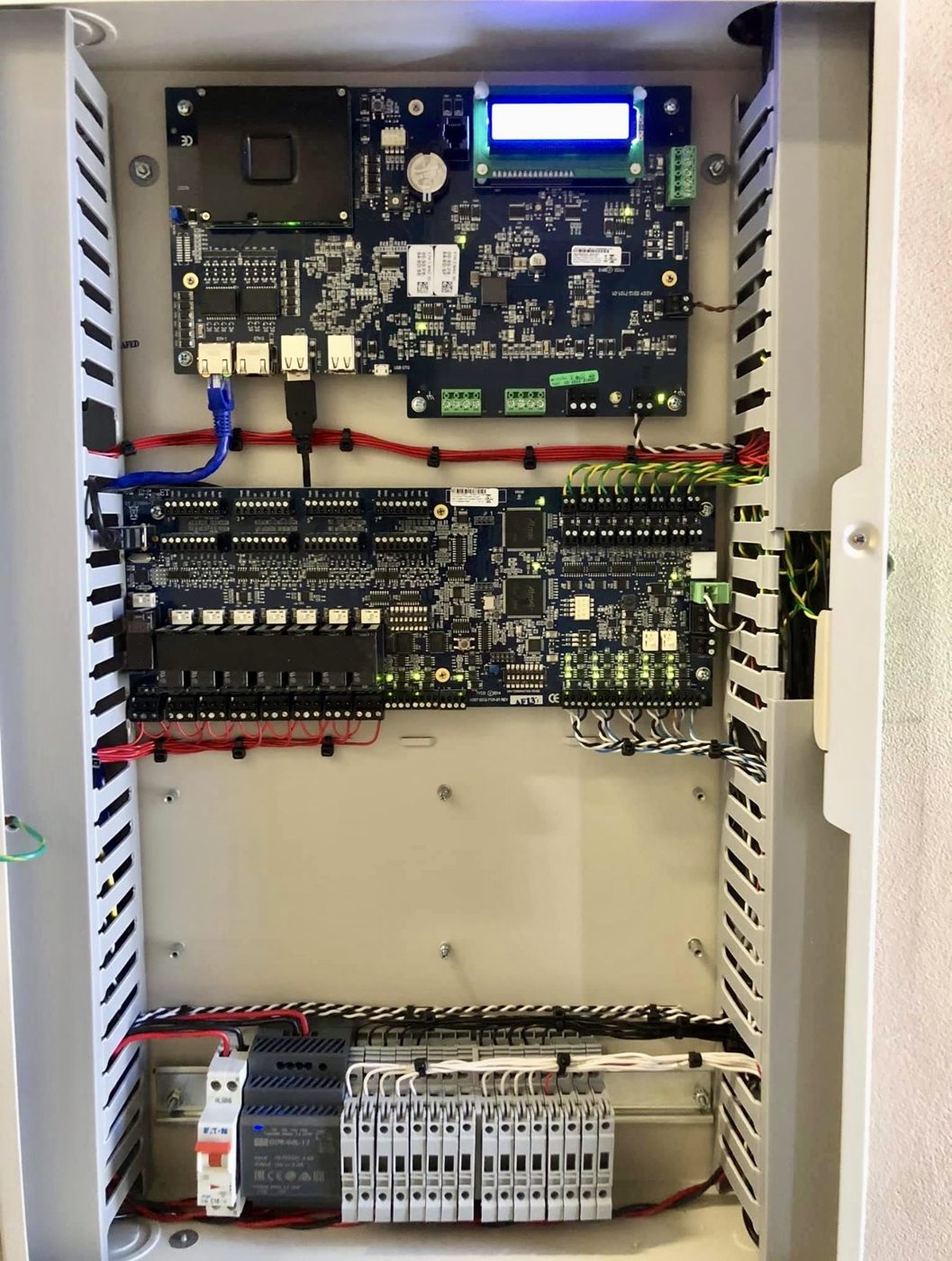 Multi-module access control board on DIN rail, representative of national multi-site rollouts